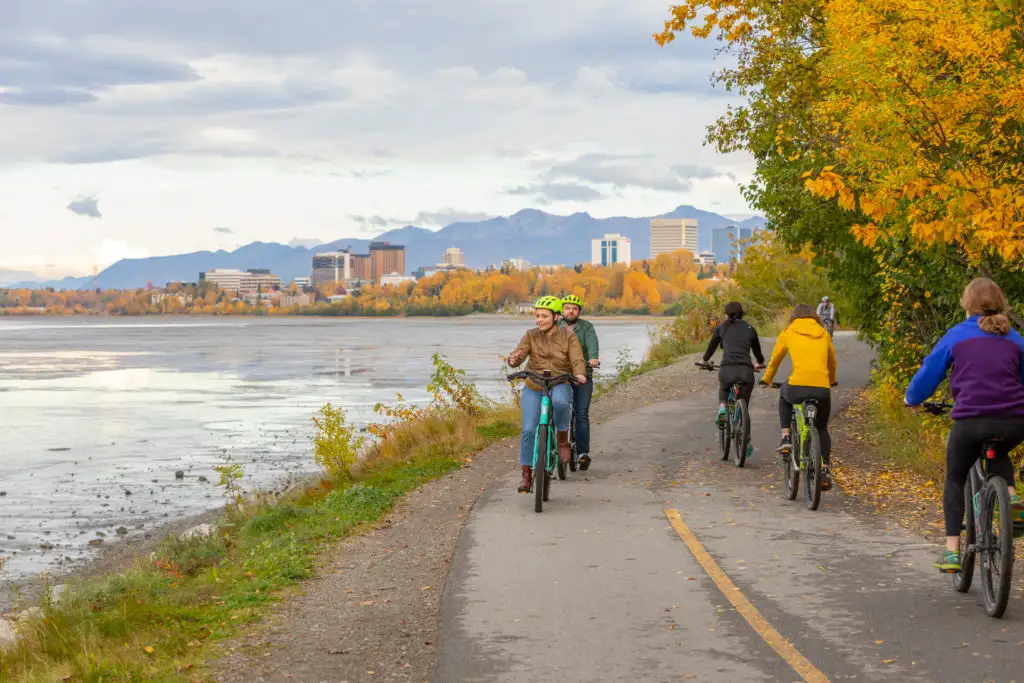 People riding bikes on the Tony Knowles Coastal Trail