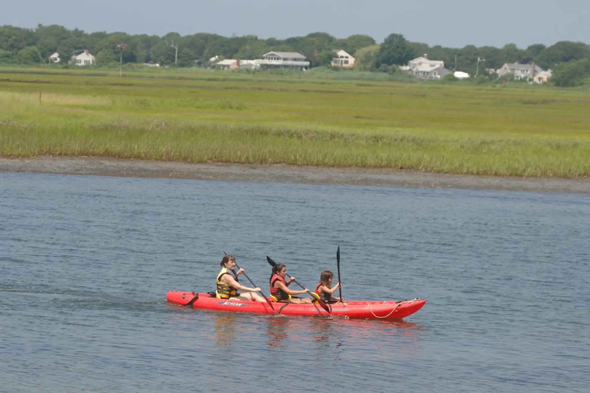 Red Jacket Beach Resort and Spa, 3 people on red kayak