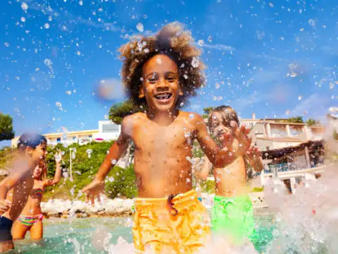 Children playing in a shallow pool