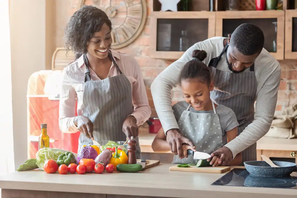 Parents cooking with child