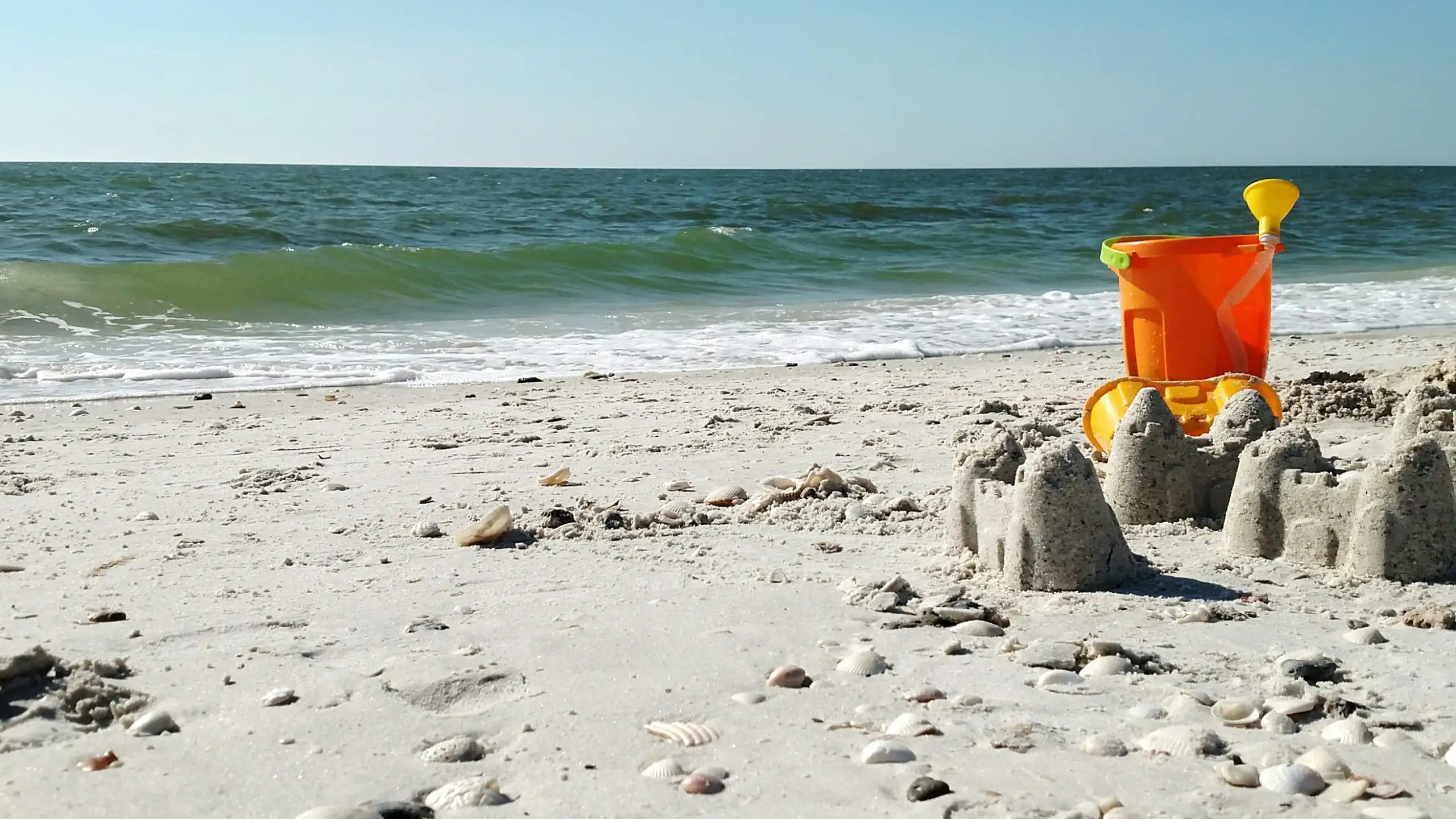 Sandcastles and sand toys on the beach