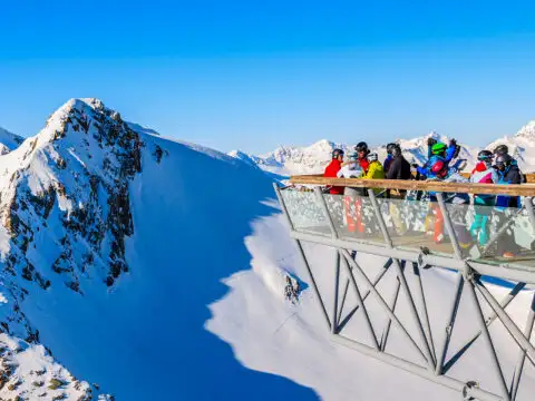 Skiers looking at mountains from platform in Solden ski ; Courtesy of Pawel Kazmierczak/Shutterstock