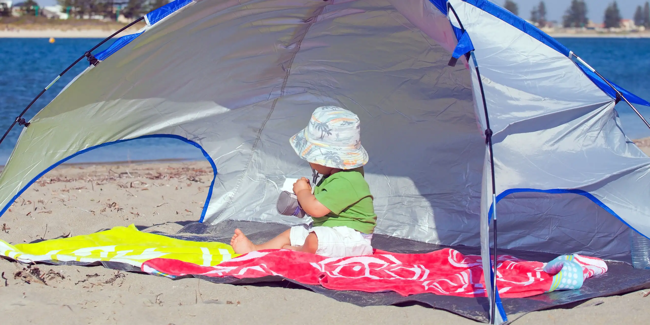 Baby In Beach Tent; Courtesy of Marcella Miriello/Shutterstock.com