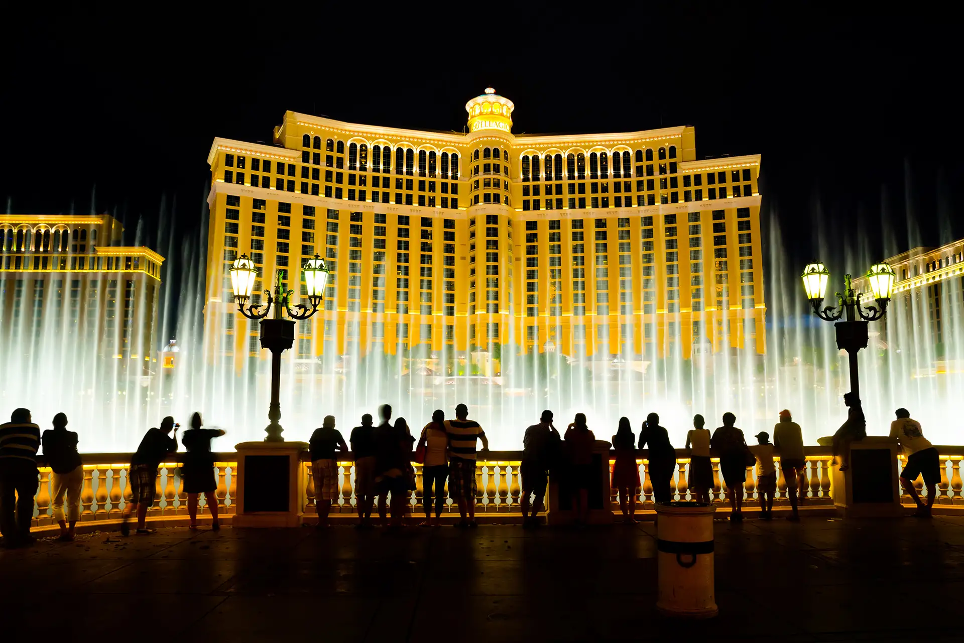 People watch the musical fountains at Bellagio Hotel & Casino in Las Vegas.