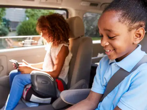 children in car using booster seat