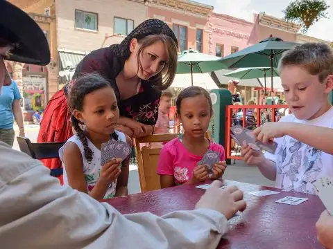 Kids Playing Cards in Deadwood, South Dakota; Courtesy of Travel South Dakota