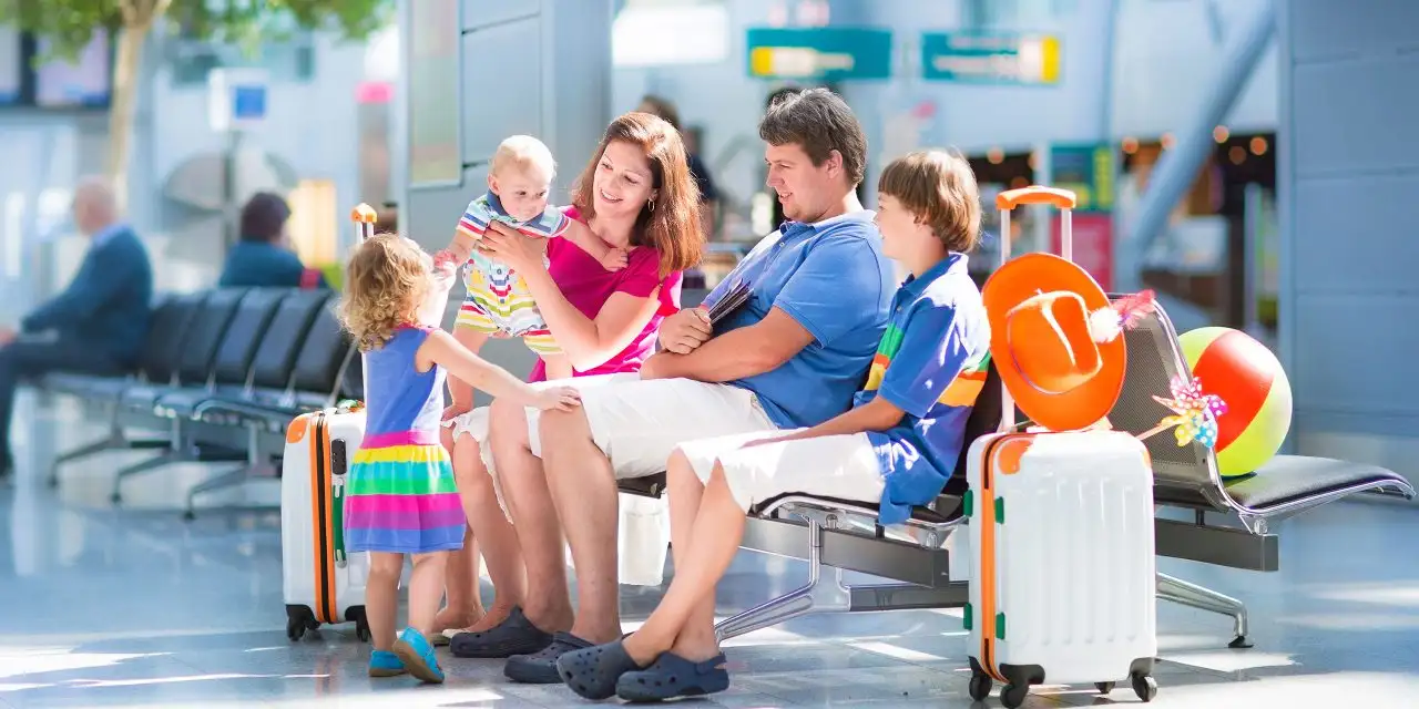 Family at Airport; Courtesy of FamVeld/Shutterstock.com