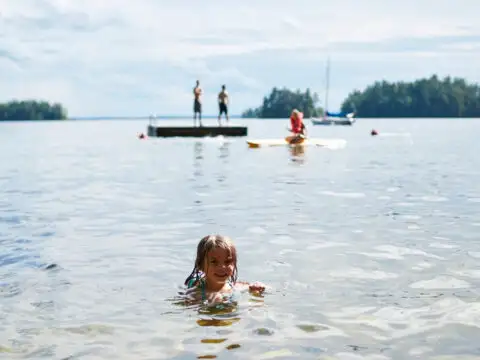 Little Girl Swimming at Migis Lodge in South Casco, ME; Courtesy of Migis Lodge