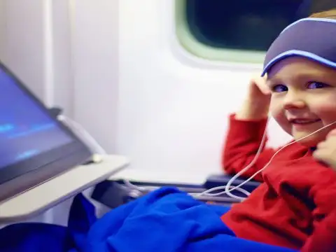 Kid On Plane; Courtesy of Olesia Bilkei/Shutterstock.com