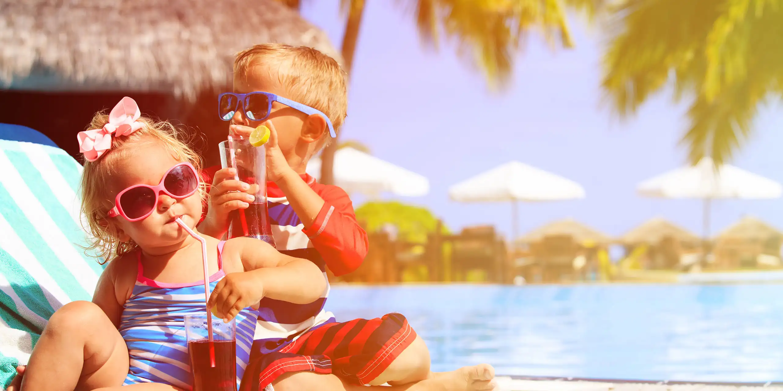 Kids by the Pool; Courtesy of NadyaEugene/Shutterstock.com