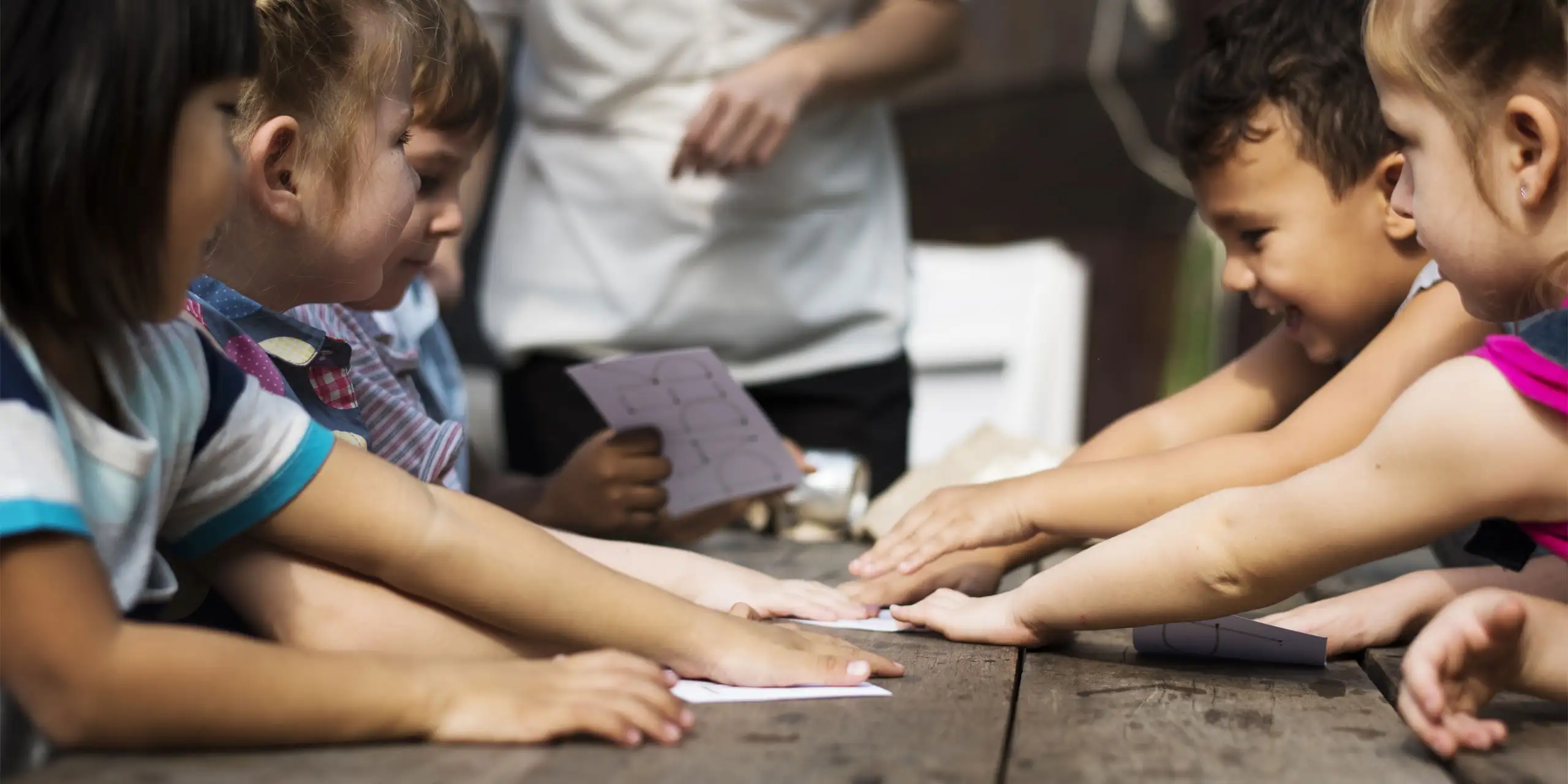 Kids Playing Cards; Courtesy of Rawpixel.com/Shutterstock.com