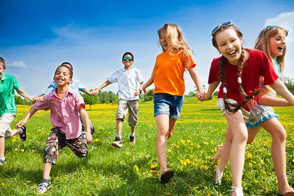 A group of kids playing in a field.