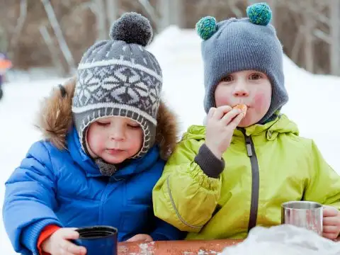 Little Boys Sipping Hot Cocoa; Courtesy of mamaza/Shutterstock.com