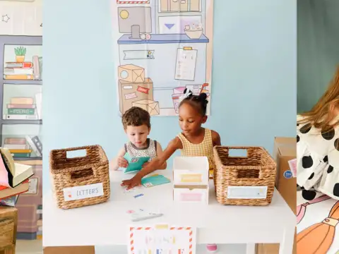 Children playing with Magic Playbook activity printouts