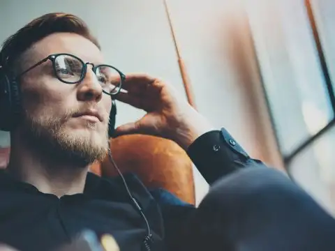 Man Wearing Headphones; Courtesy of SFIO CRACHO/Shutterstock.com