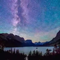 milky way above saint mary lake in glacier national park, montana, on summer night