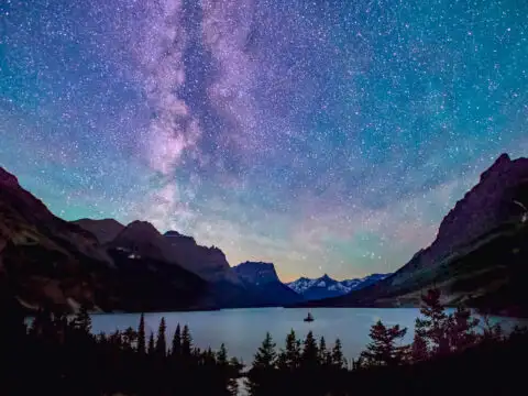 milky way above saint mary lake in glacier national park, montana, on summer night