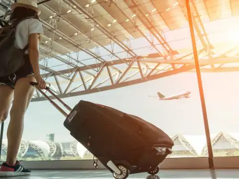 Teen Traveling in Airport; Courtesy of BR Photo Addicted/Shutterstock.com