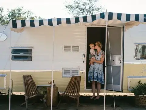 Mom and Baby in Front of Airstream Trailer at The Holidays Camp Community in San Clemente, California; Courtesy of Rebecca Kent