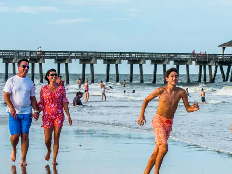 family on beach in tybee island; Courtesy of Courtesy of Visit Tybee Island