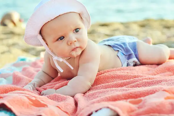 Baby on Beach; Courtesy of Elena Stepanova/Shutterstock.com