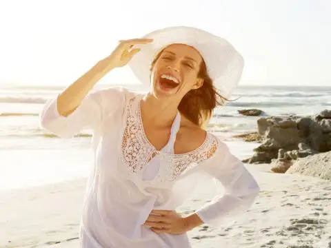 Woman On The Beach; Courtesy of mimagephotography/Shutterstock.com